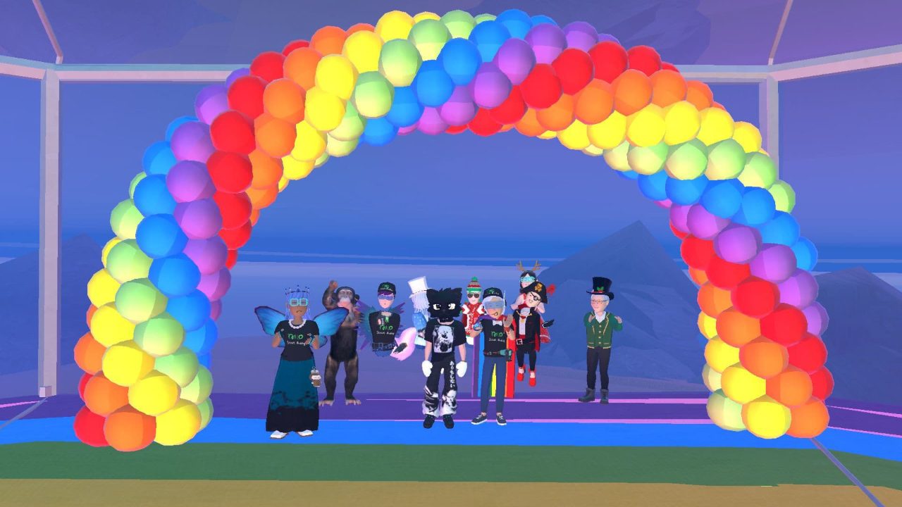 The Rec Room community under a rainbow balloon arch